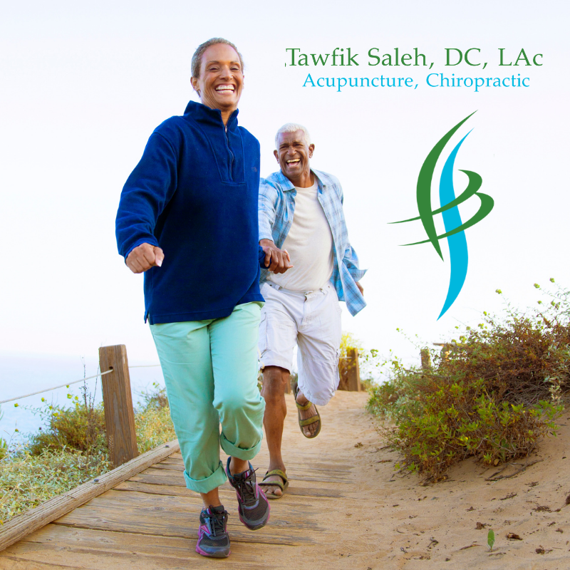 Active couple walking on a coastal path